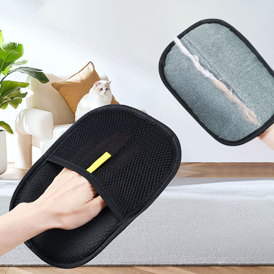 Pet hair removal glove cleaning fur from a sofa